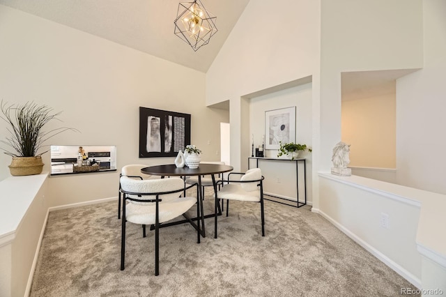 5016 S Nelson St Unit C, Littleton, CO 80127 - dining space with carpet floors, high vaulted ceiling, a chandelier, and baseboards