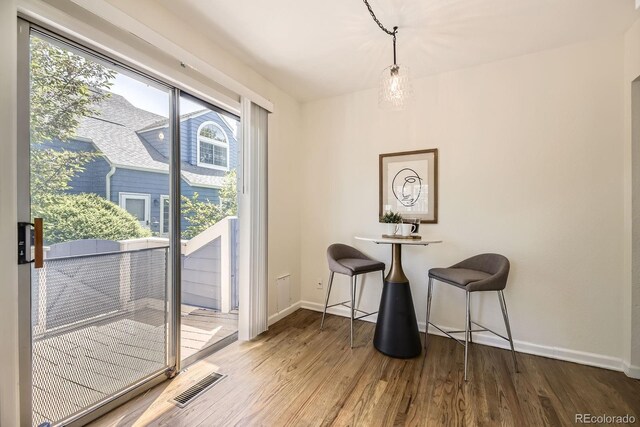 5016 S Nelson St Unit C, Littleton, CO 80127 - dining area with baseboards and wood finished floors