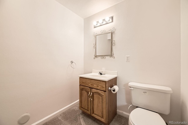 5016 S Nelson St Unit C, Littleton, CO 80127 - bathroom featuring baseboards, toilet, and vanity