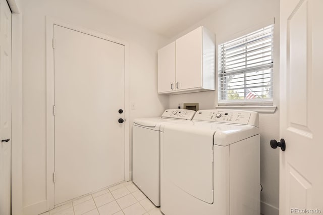 5016 S Nelson St Unit C, Littleton, CO 80127 - washroom featuring cabinet space, separate washer and dryer, and light tile patterned floors