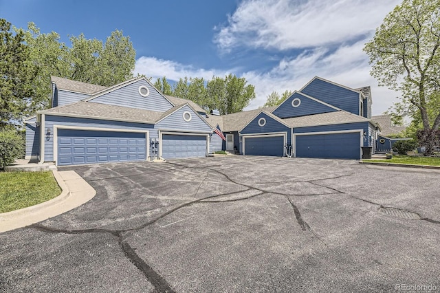 5016 S Nelson St Unit C, Littleton, CO 80127 - view of front facade with a garage and driveway