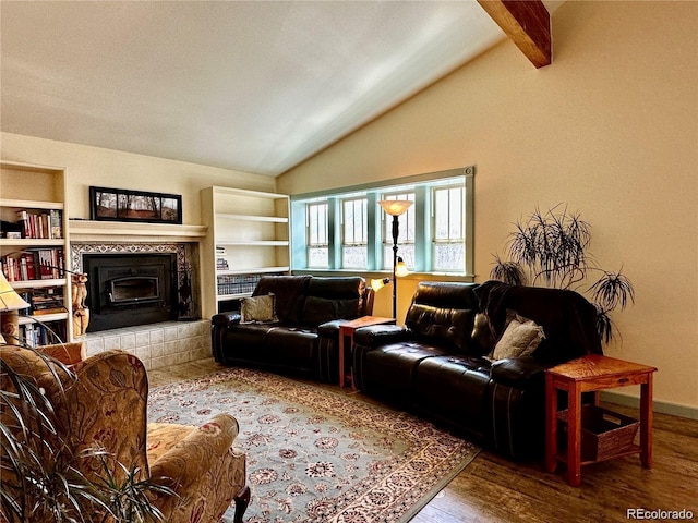 living room with lofted ceiling with beams and hardwood / wood-style flooring