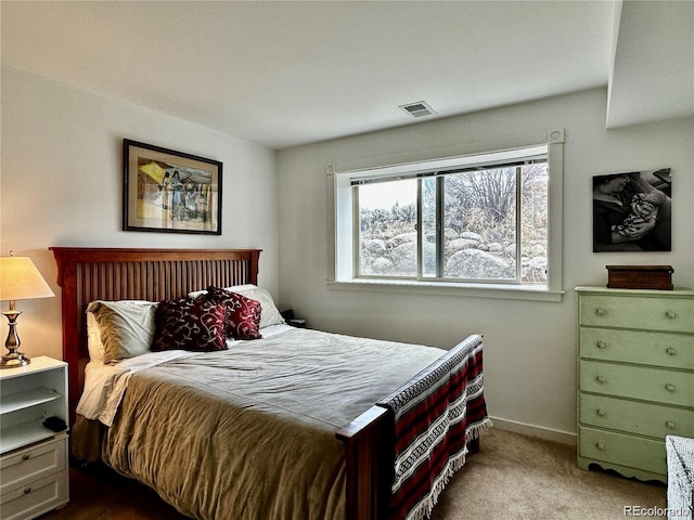 bedroom with light colored carpet