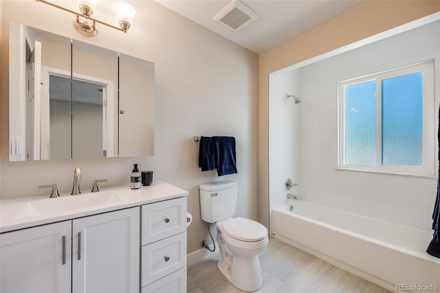 bathroom with visible vents, toilet, tub / shower combination, vanity, and baseboards