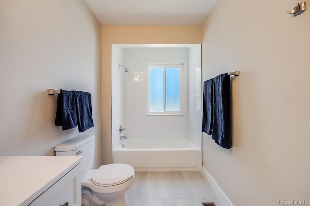 full bathroom with toilet, baseboards, shower / bathing tub combination, and vanity