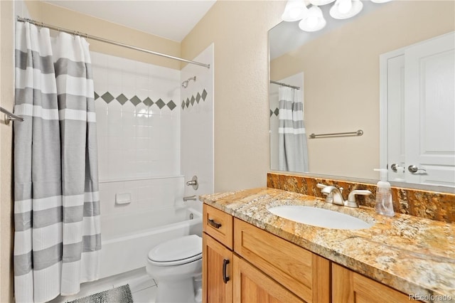 bathroom featuring shower / tub combo, vanity, and toilet