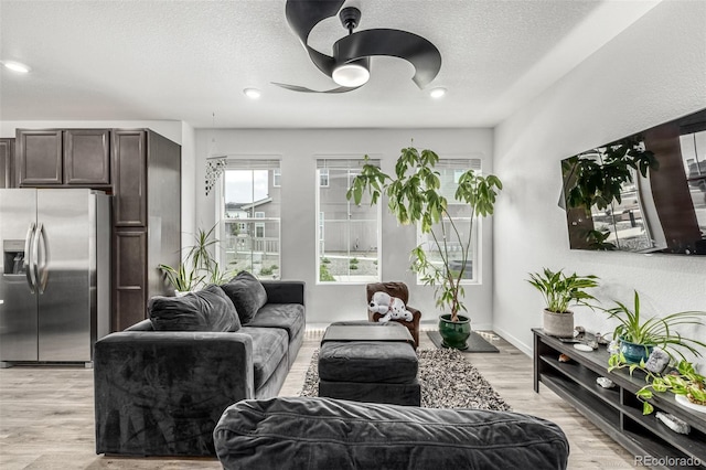 1500 Sun Way, Lafayette, CO 80026 - living room with a ceiling fan, a textured ceiling, light wood finished floors, and recessed lighting