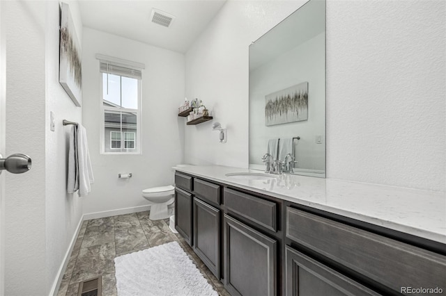 1500 Sun Way, Lafayette, CO 80026 - bathroom with toilet, baseboards, and vanity
