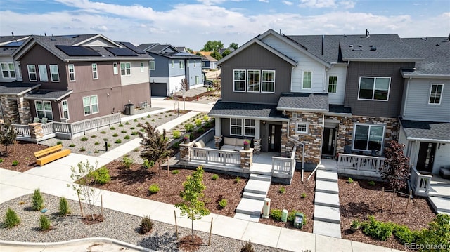 1500 Sun Way, Lafayette, CO 80026 - view of property featuring a residential view, stone siding, and a shingled roof