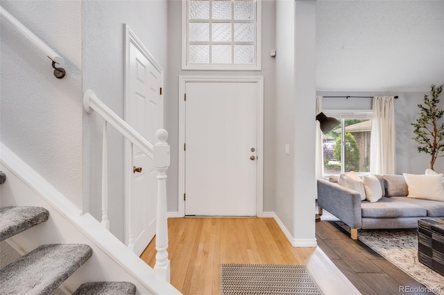 3889 S Fraser St, Aurora, CO 80014 - entryway featuring light wood-style flooring, stairs, and baseboards