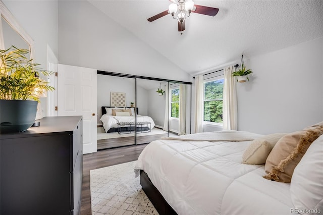 3889 S Fraser St, Aurora, CO 80014 - bedroom featuring dark wood finished floors, high vaulted ceiling, and ceiling fan