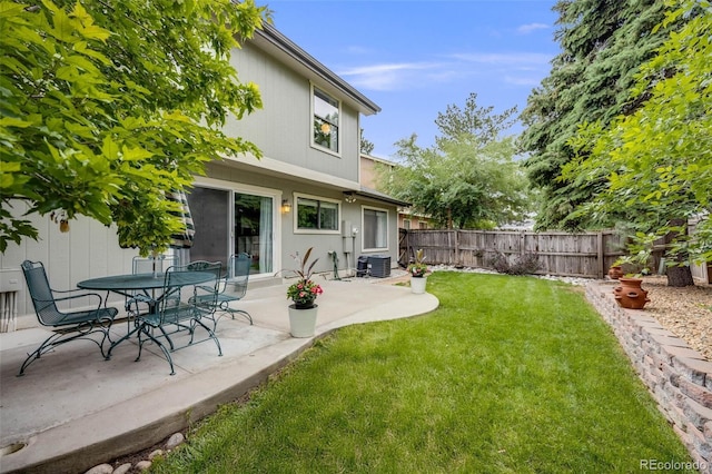 3889 S Fraser St, Aurora, CO 80014 - fenced backyard featuring a patio area
