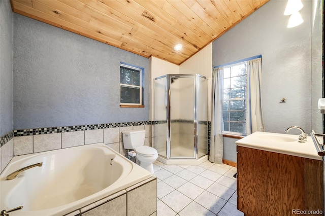 46 Apache Rd, Evergreen, CO 80439 - bathroom with vaulted ceiling, tile patterned flooring, a garden tub, a shower stall, and wooden ceiling