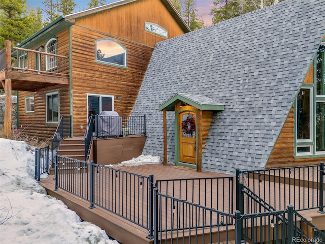 46 Apache Rd, Evergreen, CO 80439 - view of front of home with stairway, a deck, a balcony, and a shingled roof