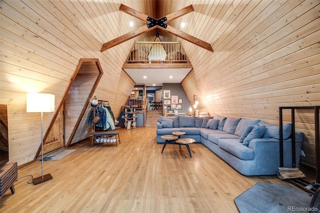 46 Apache Rd, Evergreen, CO 80439 - living area featuring wood walls, vaulted ceiling with beams, and wood-type flooring