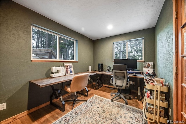 46 Apache Rd, Evergreen, CO 80439 - office space with a textured wall, a healthy amount of sunlight, and wood finished floors