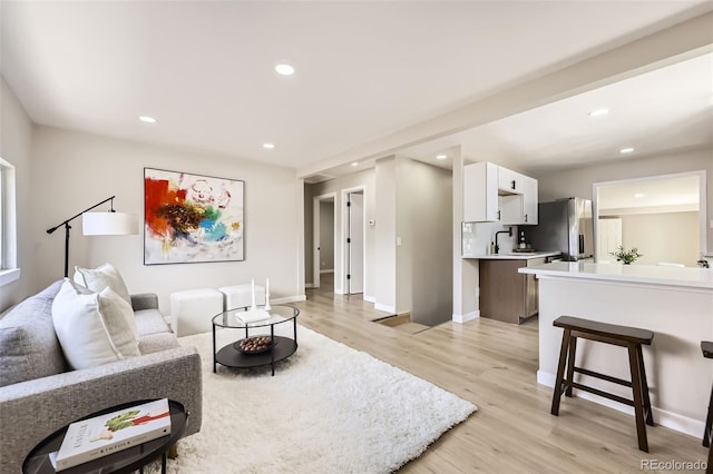 1750 S Zuni St, Denver, CO 80223 - living room with light wood-type flooring and recessed lighting