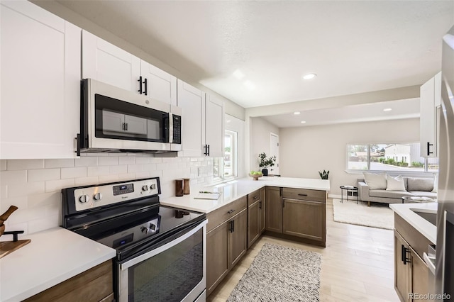1750 S Zuni St, Denver, CO 80223 - kitchen with stainless steel appliances, light countertops, tasteful backsplash, and recessed lighting