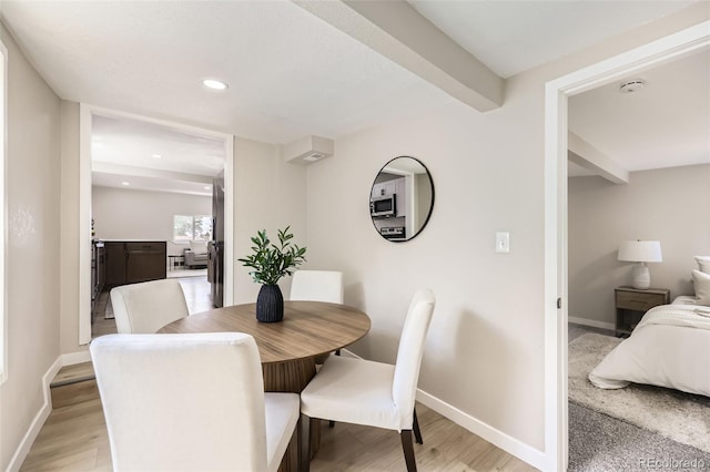 1750 S Zuni St, Denver, CO 80223 - dining area featuring beamed ceiling, recessed lighting, and light wood-style floors