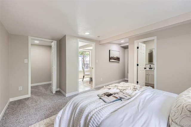 1750 S Zuni St, Denver, CO 80223 - bedroom featuring light colored carpet, recessed lighting, and ensuite bathroom