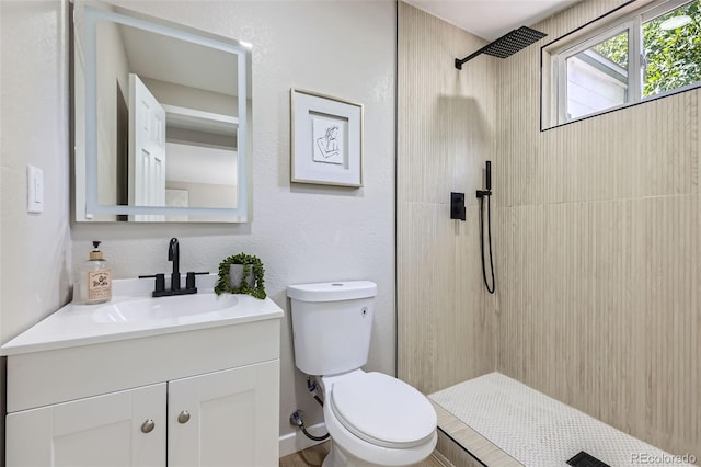1750 S Zuni St, Denver, CO 80223 - full bathroom featuring vanity and a tile shower