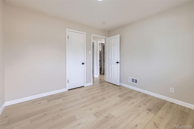 1750 S Zuni St, Denver, CO 80223 - unfurnished bedroom with baseboards and light wood-type flooring