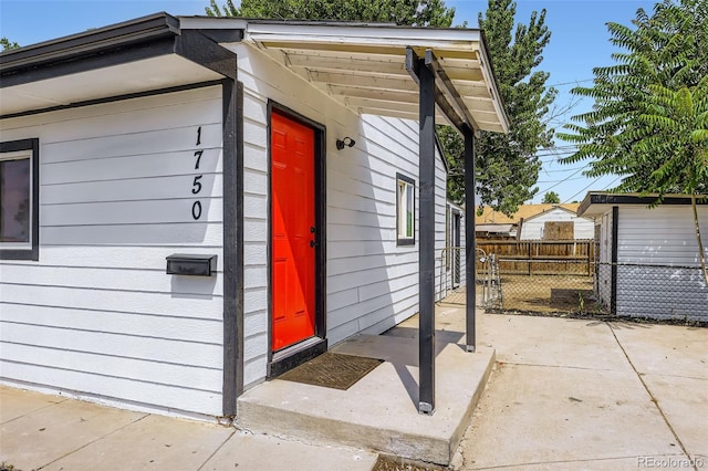 1750 S Zuni St, Denver, CO 80223 - view of exterior entry featuring a patio area