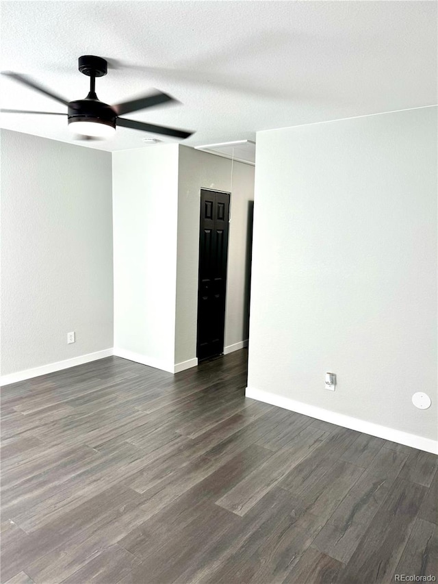 spare room featuring a textured ceiling, dark hardwood / wood-style floors, and ceiling fan