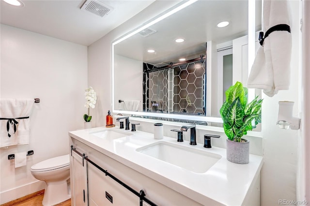 1250 N Humboldt St Unit 202, Denver, CO 80218 - bathroom featuring double vanity, recessed lighting, and a shower