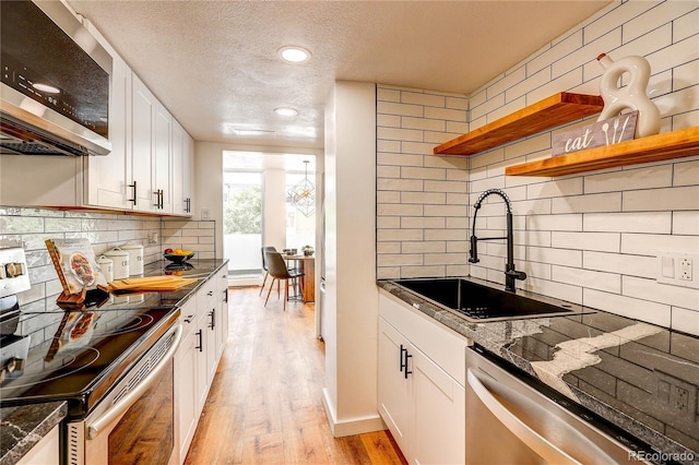 1250 N Humboldt St Unit 202, Denver, CO 80218 - kitchen featuring appliances with stainless steel finishes, tasteful backsplash, open shelves, white cabinetry, and a textured ceiling