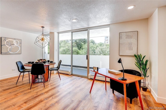 1250 N Humboldt St Unit 202, Denver, CO 80218 - dining space with a baseboard radiator, expansive windows, light wood-type flooring, a textured ceiling, and recessed lighting