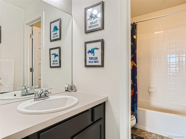 full bathroom featuring vanity, shower / tub combo, and toilet