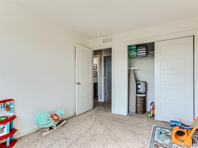 playroom featuring light colored carpet