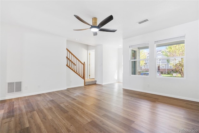 empty room featuring wood-type flooring and ceiling fan