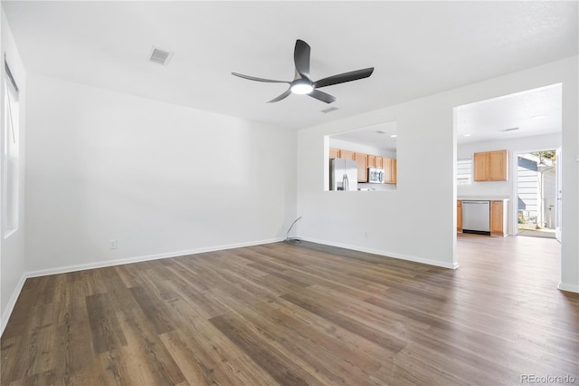 interior space with dark hardwood / wood-style flooring and ceiling fan