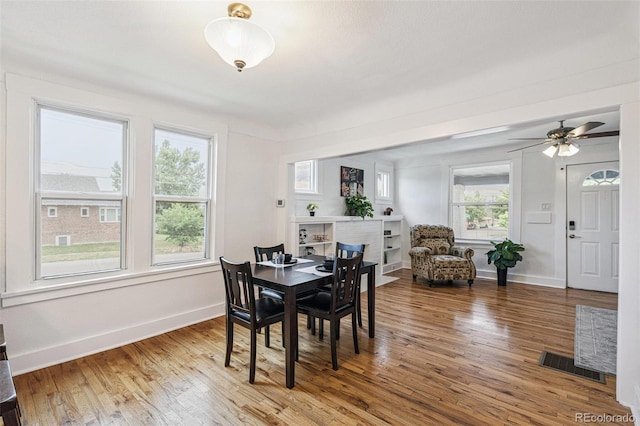 2800 N Fillmore St, Denver, CO 80205 - dining room featuring wood finished floors and a ceiling fan