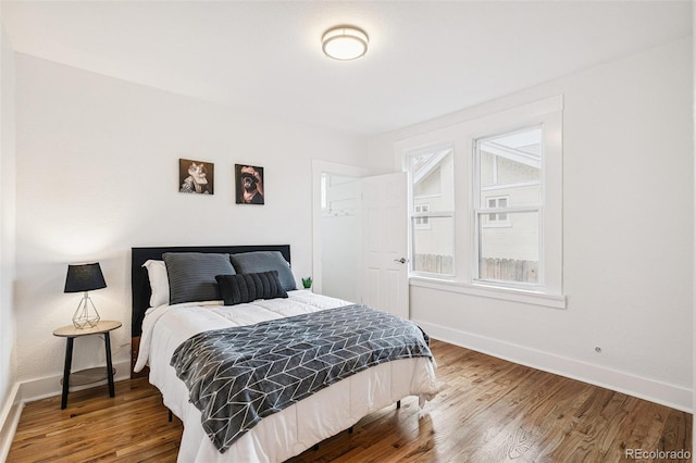2800 N Fillmore St, Denver, CO 80205 - bedroom featuring baseboards and wood finished floors