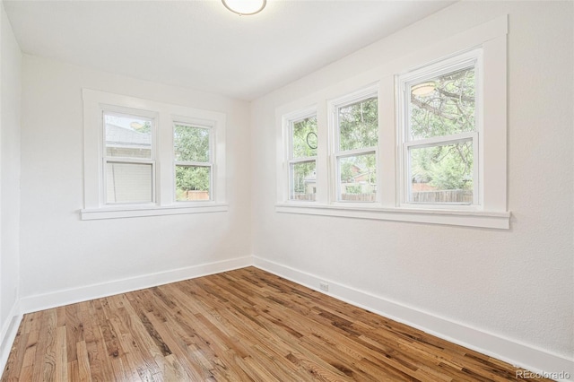 2800 N Fillmore St, Denver, CO 80205 - unfurnished room featuring baseboards and light wood finished floors