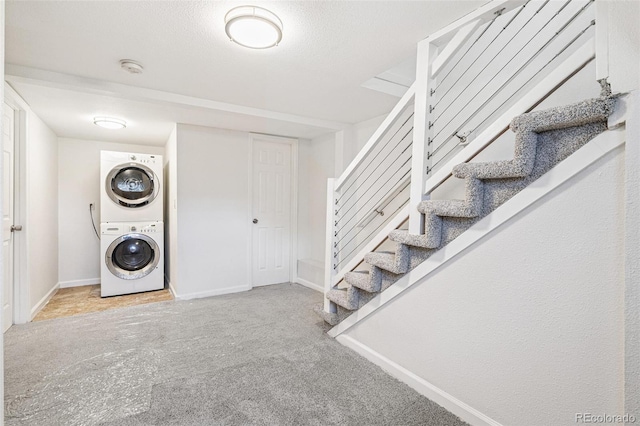 2800 N Fillmore St, Denver, CO 80205 - laundry room with stacked washer / drying machine and carpet