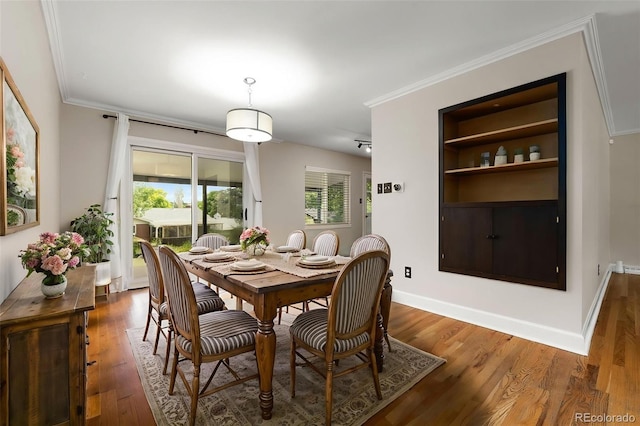 2672 S Magnolia St, Denver, CO 80224 - dining room with wood finished floors and crown molding