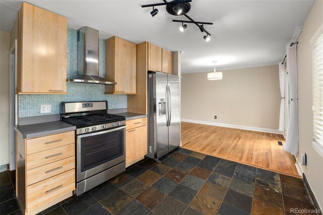 2672 S Magnolia St, Denver, CO 80224 - kitchen featuring appliances with stainless steel finishes, wall chimney range hood, light brown cabinets, dark countertops, and crown molding