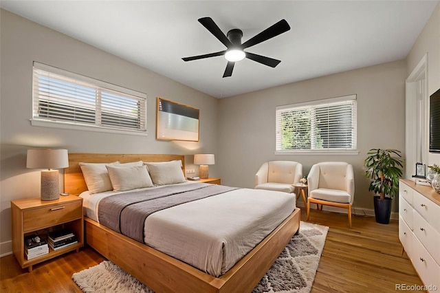 2672 S Magnolia St, Denver, CO 80224 - bedroom with light wood finished floors and ceiling fan