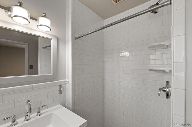 2672 S Magnolia St, Denver, CO 80224 - full bath featuring a tile shower and tile walls