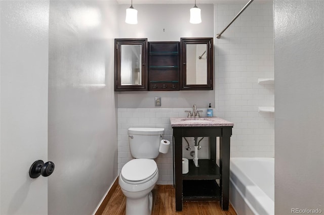 2672 S Magnolia St, Denver, CO 80224 - bathroom with wood finished floors and  shower combination