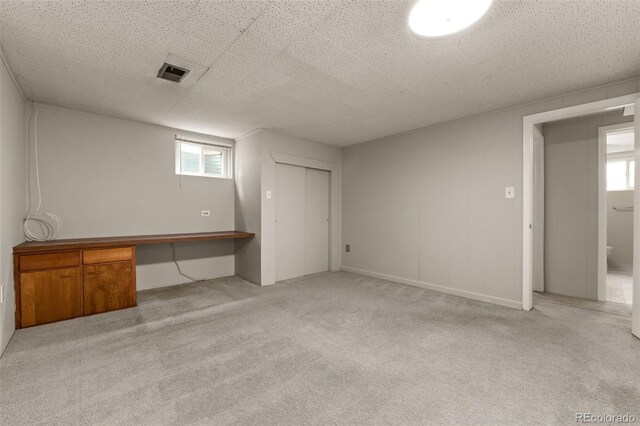 2672 S Magnolia St, Denver, CO 80224 - below grade area featuring carpet flooring and built in study area