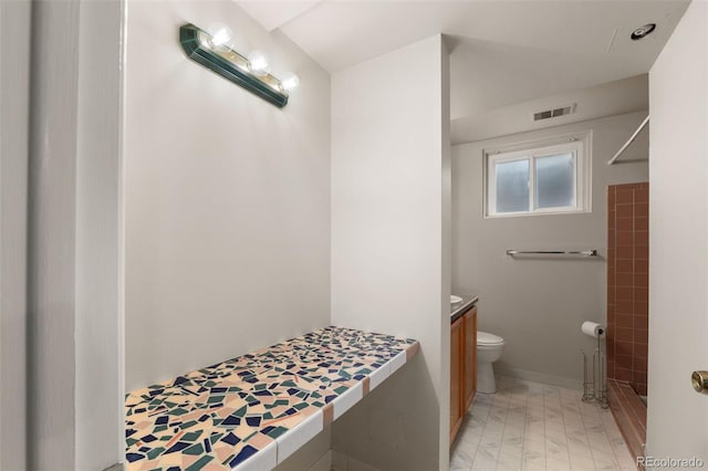 2672 S Magnolia St, Denver, CO 80224 - full bathroom featuring a stall shower, marble look tile flooring, and vanity