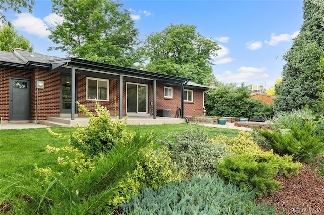 2672 S Magnolia St, Denver, CO 80224 - rear view of house with brick siding and a yard