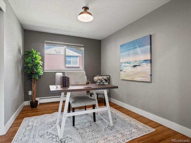 6943 Oak Way, Arvada, CO 80004 - office area featuring baseboard heating and wood finished floors