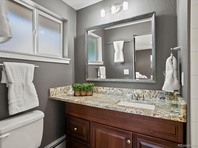 6943 Oak Way, Arvada, CO 80004 - bathroom with vanity and a textured wall