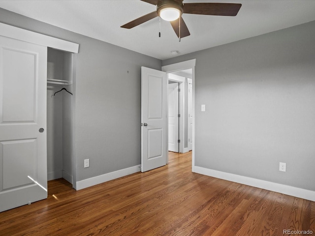 6943 Oak Way, Arvada, CO 80004 - unfurnished bedroom featuring a closet, wood finished floors, and ceiling fan
